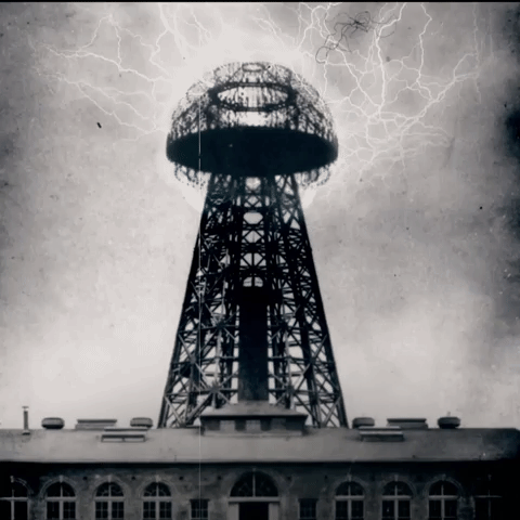 A GIF of a vintage photo of a Tesla tower with electric arcs firing from it